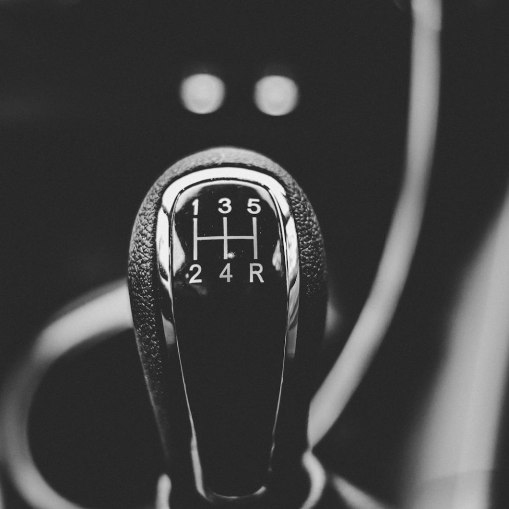 focus photography of car shift gear